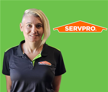 woman in front of servpro logo